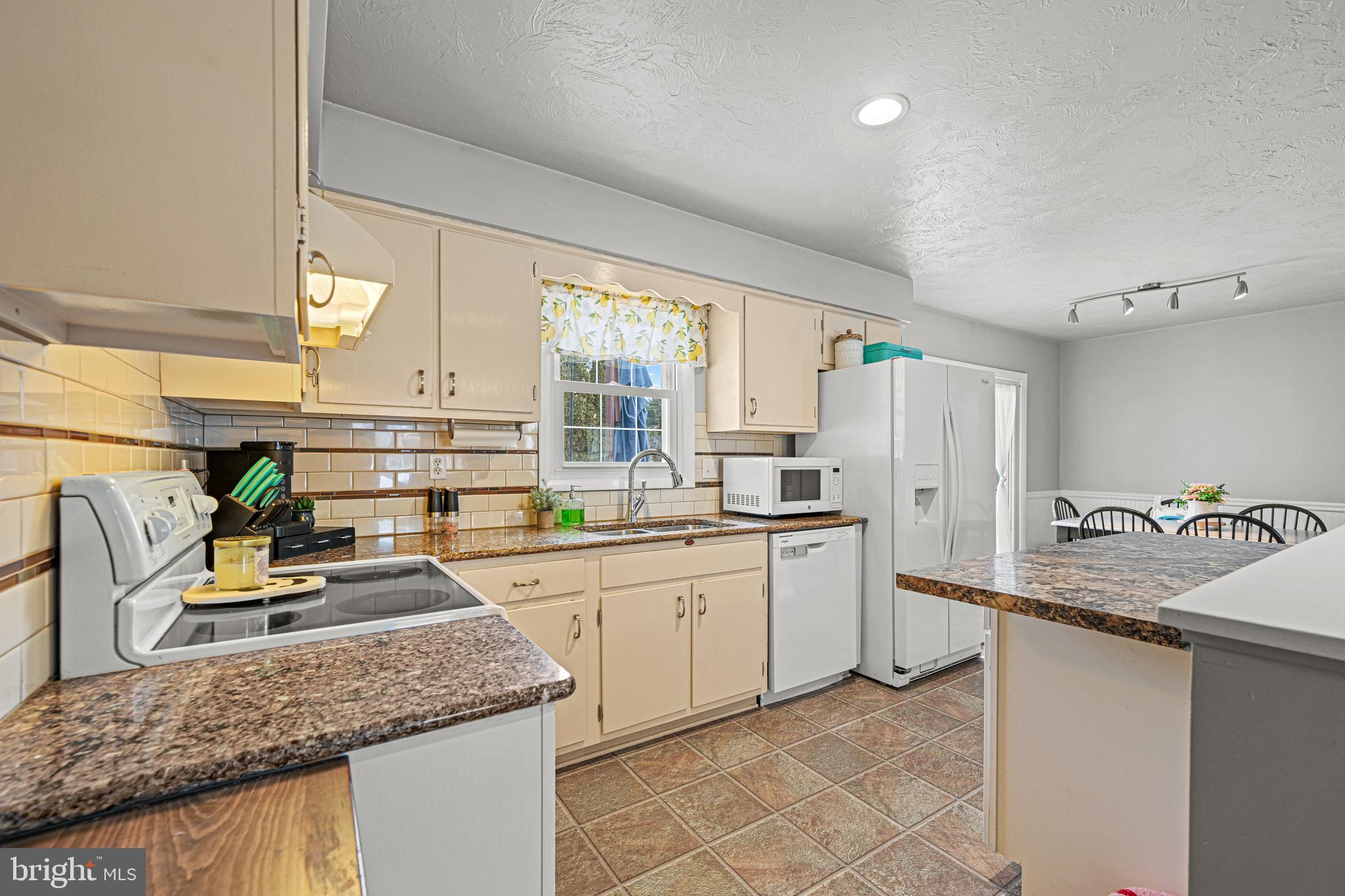 3541 Village Road Dover, PA 17315 - Photo 5 of 36 a kitchen with a sink refrigerator and window