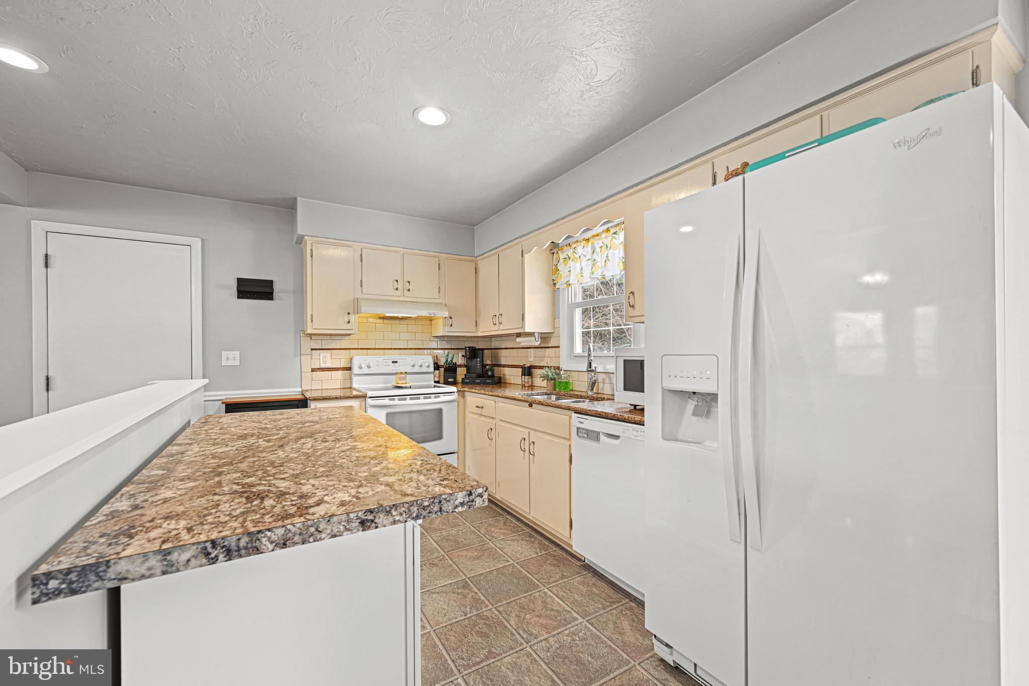 3541 Village Road Dover, PA 17315 - Photo 6 of 36 a kitchen with stainless steel appliances granite countertop a refrigerator and a stove top oven