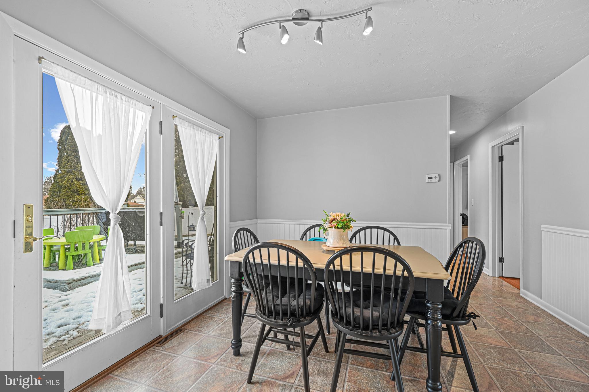 3541 Village Road Dover, PA 17315 - Photo 9 of 36 a view of a dining room with furniture window and wooden floor
