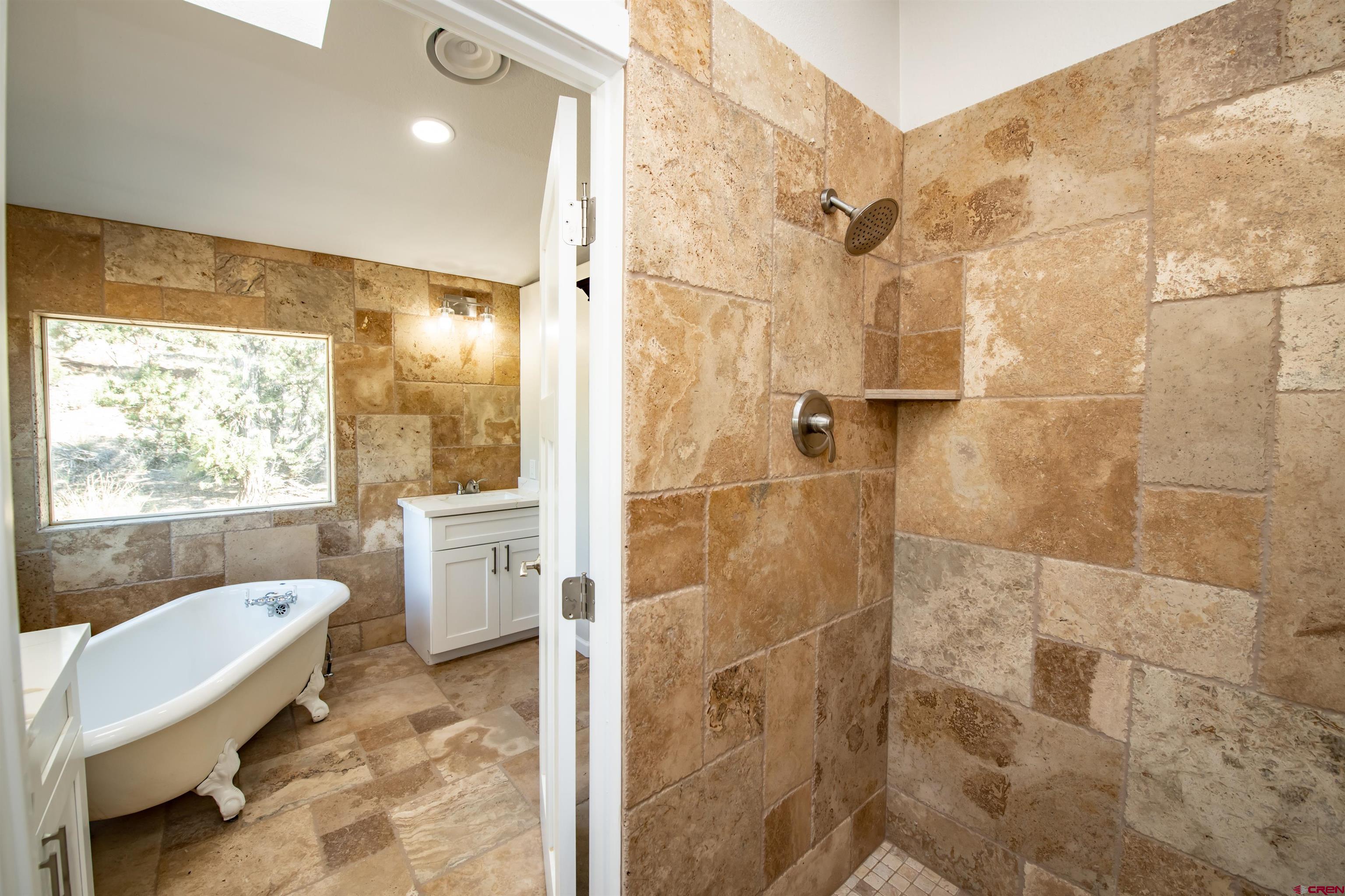 475 Run Around Road Arboles, CO 81121 - Photo 21 of 40 a bathroom with a sink toilet and shower