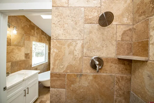 a bathroom with a sink and a bathtub
