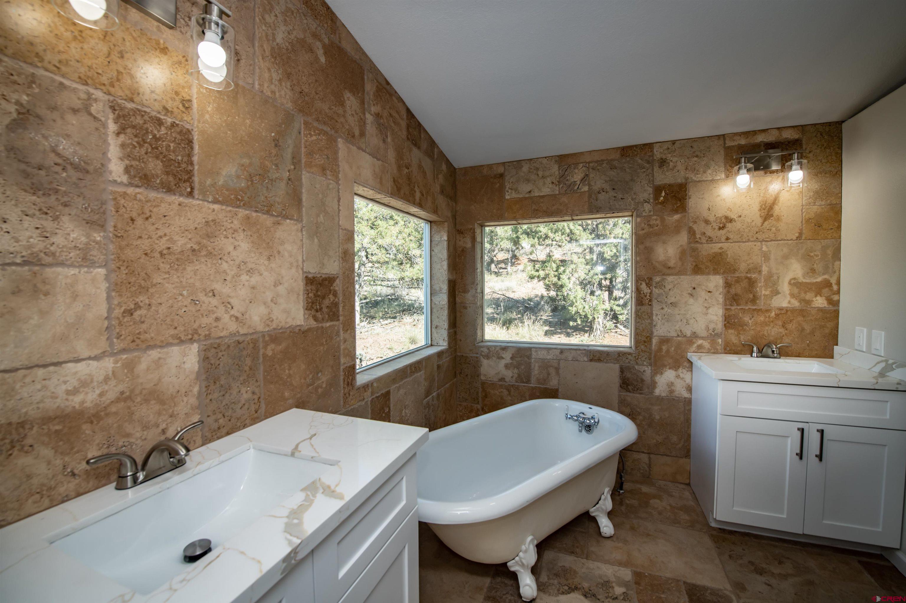 475 Run Around Road Arboles, CO 81121 - Photo 23 of 40 a bathroom with a sink and a bathtub