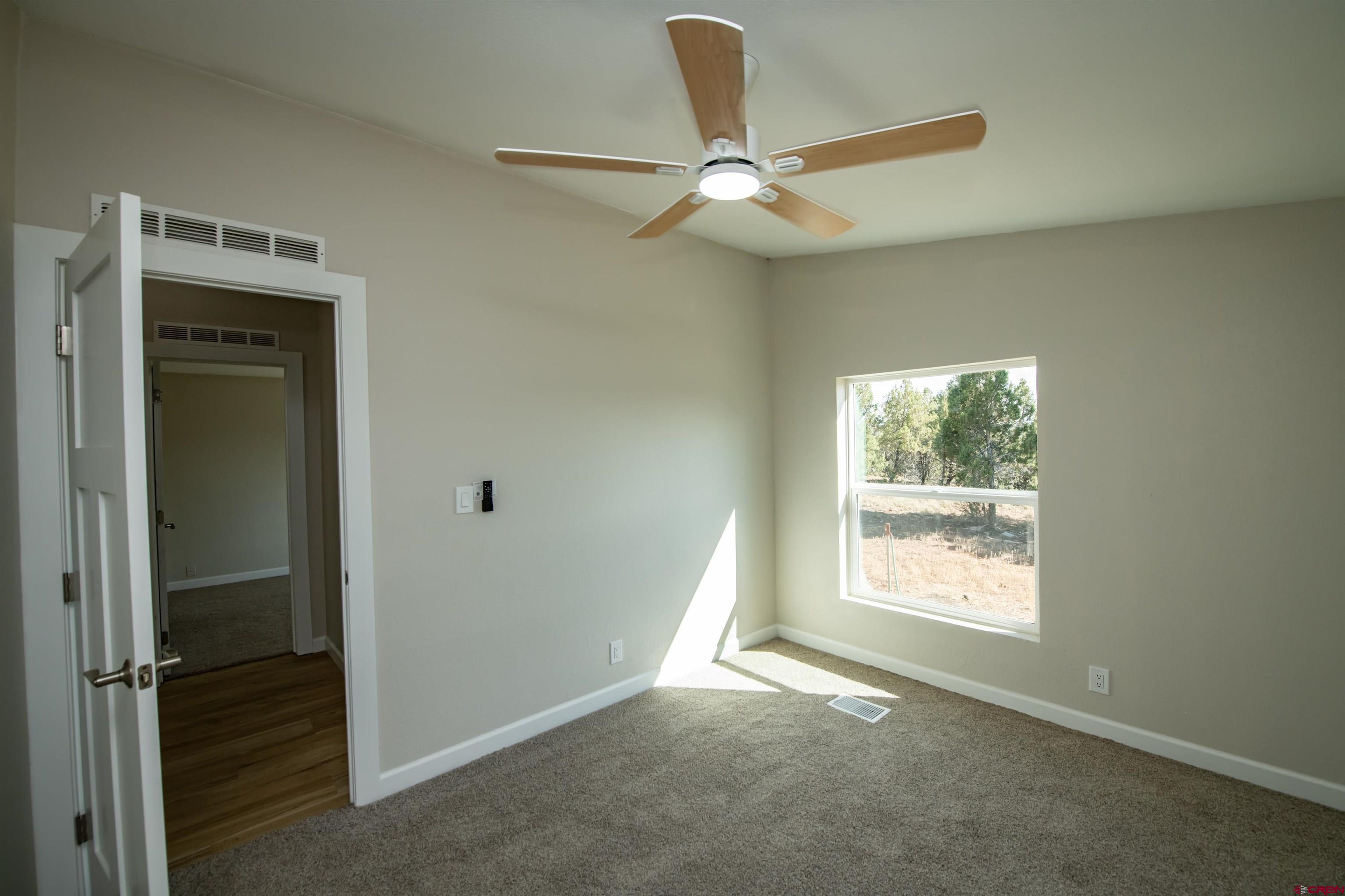 475 Run Around Road Arboles, CO 81121 - Photo 28 of 40 a view of an empty room with a window