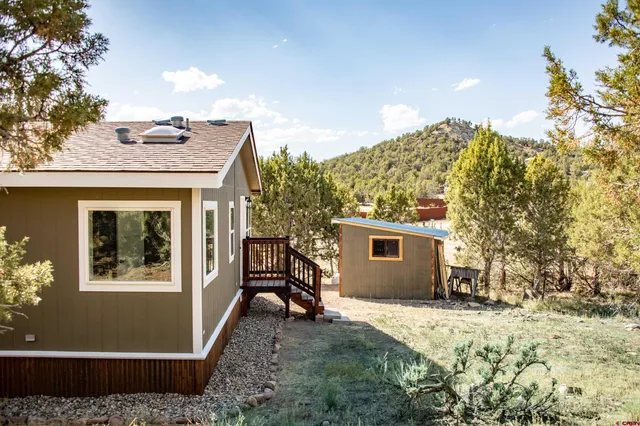 a view of a yard covered in snow