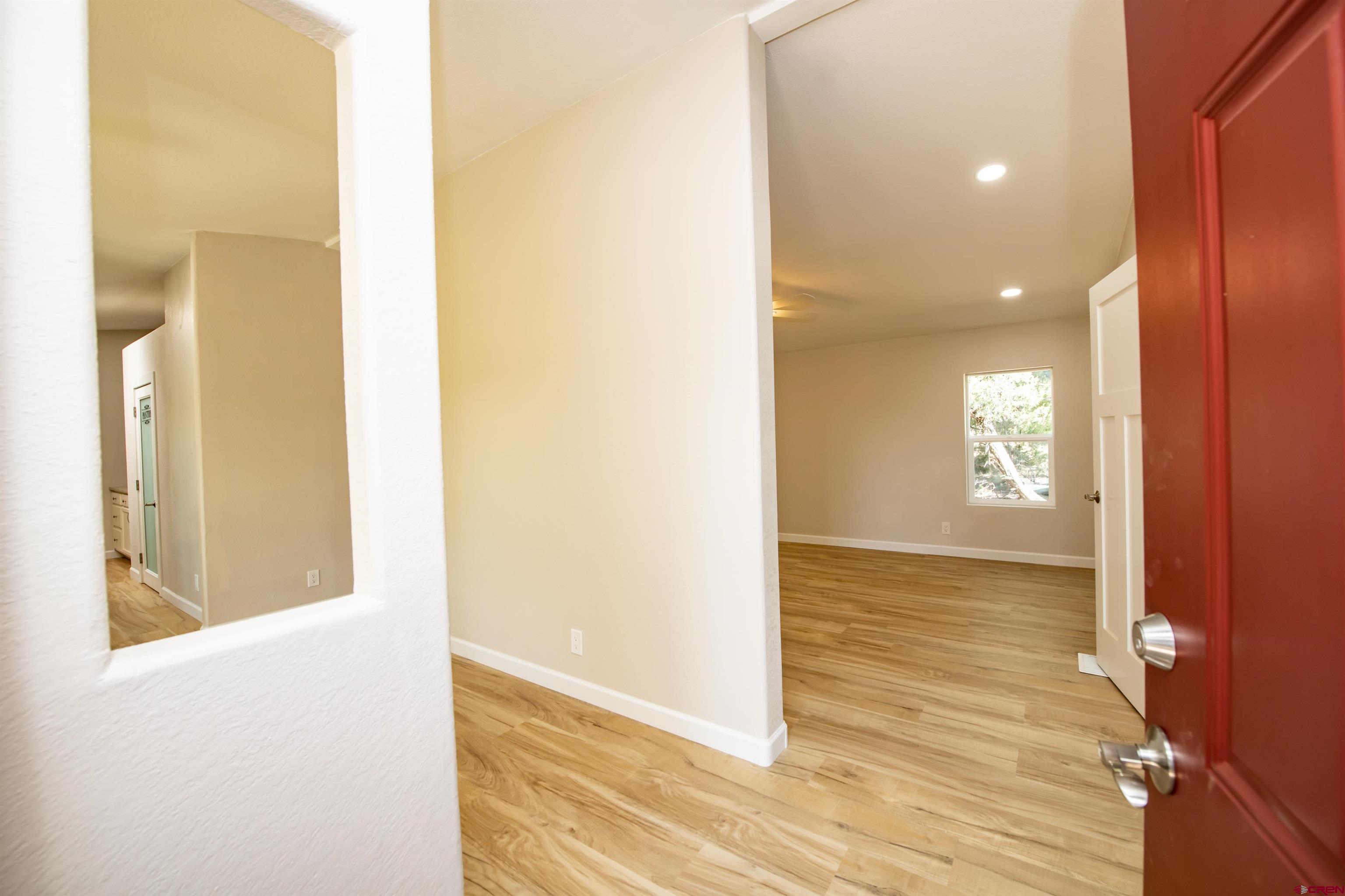 475 Run Around Road Arboles, CO 81121 - Photo 6 of 40 a view of an empty room and wooden floor