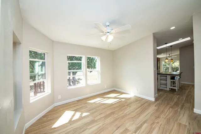 a kitchen with stainless steel appliances granite countertop a stove a sink refrigerator and a wooden cabinets