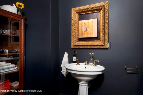 a bedroom with a bed and a fireplace