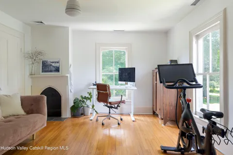 a balcony with a table and chairs
