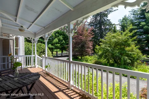 a view of a dining room with furniture and window