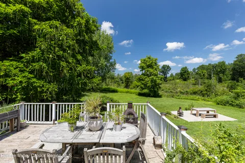 a large white kitchen with a sink and dishwasher