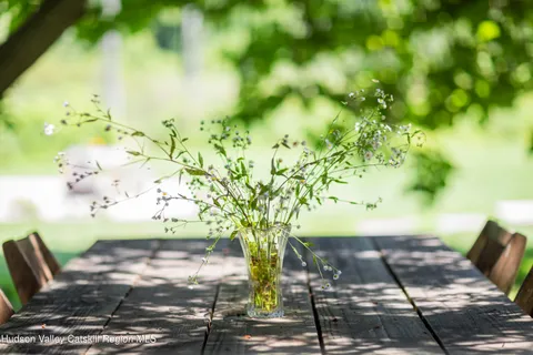 a bedroom with a bed and painting on the wall