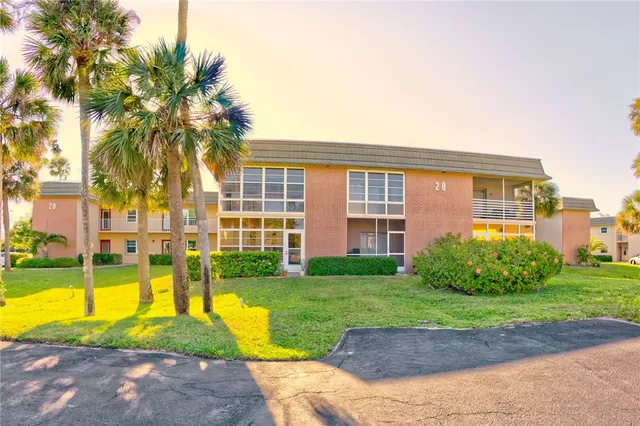 a view of backyard with swimming pool and outdoor seating