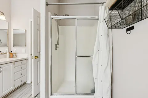 a bedroom with a bed and a mirror
