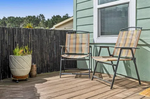 a view of a chairs and table in the patio