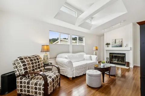 a bedroom with furniture and a fireplace