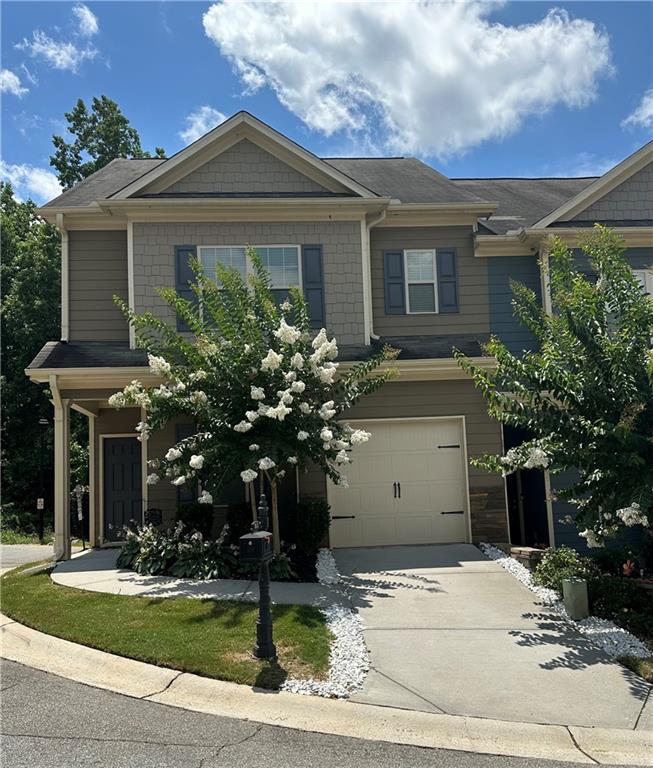 853 Ash Street Canton, GA 30114 - Photo 1 of 23 front view of a house with a yard