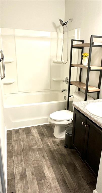 853 Ash Street Canton, GA 30114 - Photo 21 of 23 a bathroom with a toilet a sink and a bathtub