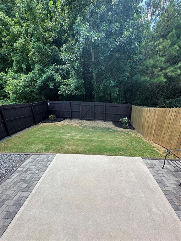 853 Ash Street Canton, GA 30114 - Photo 4 of 23 a view of a backyard with a small cabin