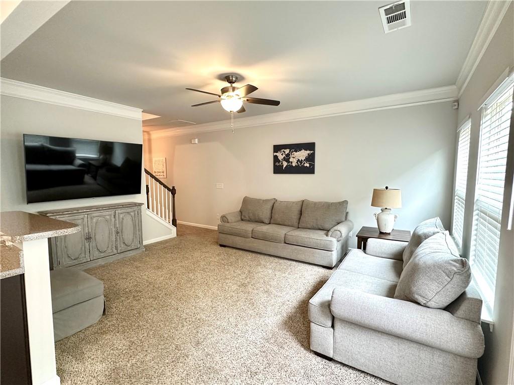853 Ash Street Canton, GA 30114 - Photo 5 of 23 a living room with furniture and a flat screen tv