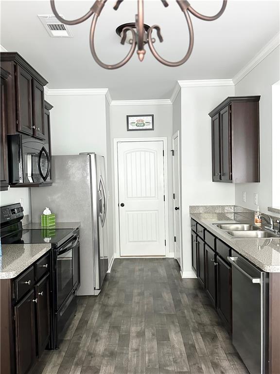 853 Ash Street Canton, GA 30114 - Photo 7 of 23 a kitchen with cabinets and stainless steel appliances