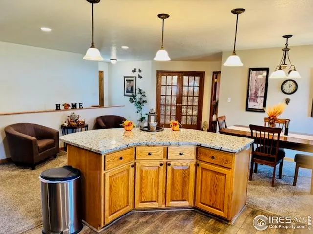 a dining room with furniture a chandelier and a rug
