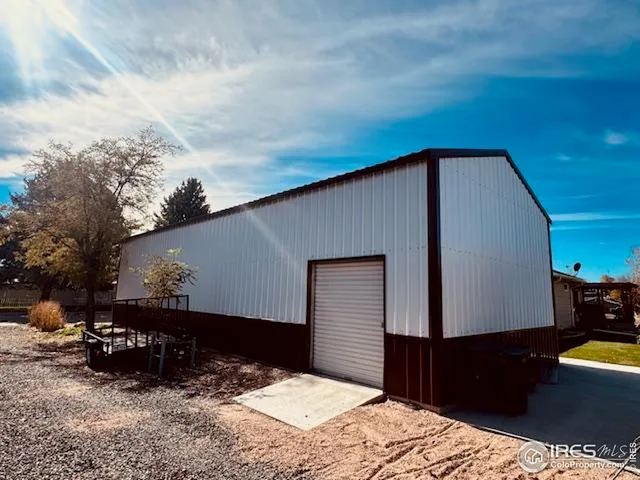 a kitchen with a refrigerator and a stove top oven