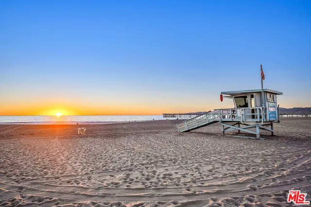 a large white kitchen with lots of counter top space