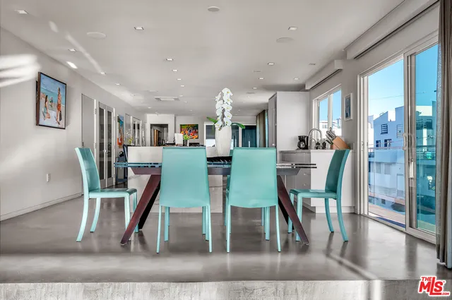 a living room with fireplace furniture and a wooden floor