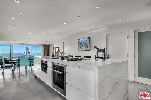 a bathroom with a shower sink and mirror
