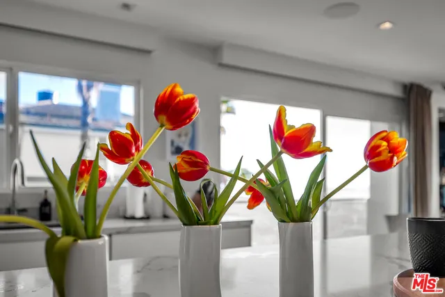 a spacious bedroom with a bed and a couch