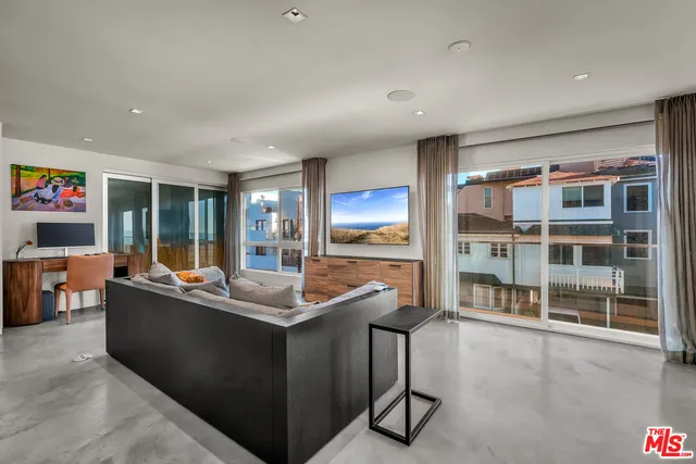 a view of an empty room with a lake view