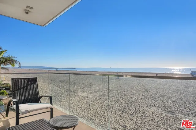 a view of a dining room with furniture wooden floor and a potted plant