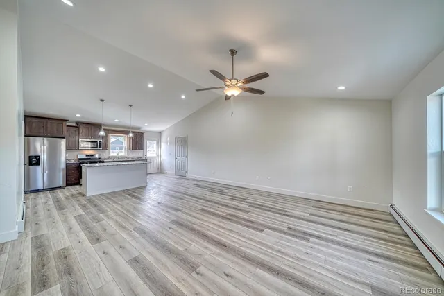 a view of a kitchen with a dishwasher and a stove top oven