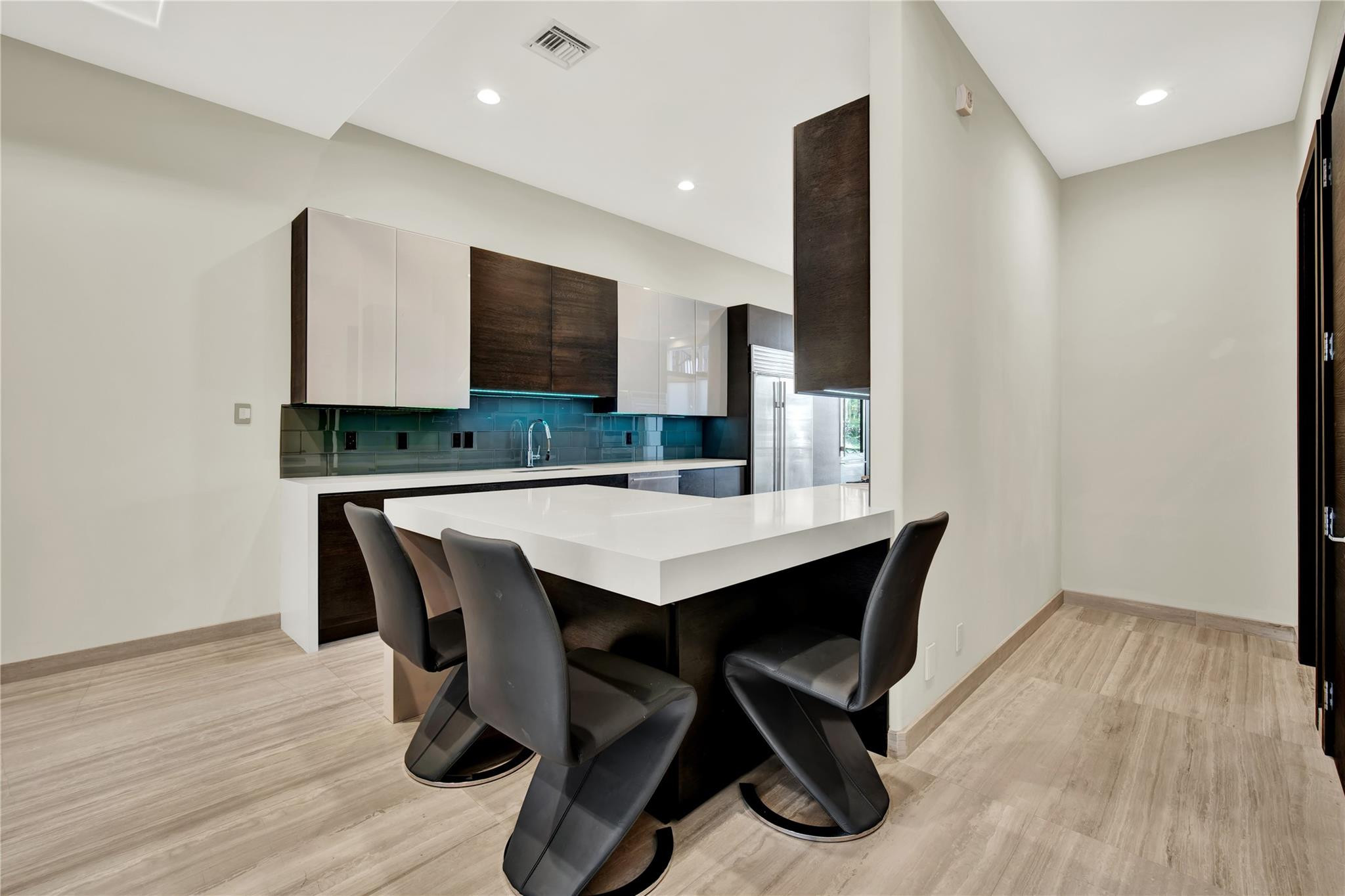 425 North Ocean Boulevard, Unit 3 Boca Raton, FL 33432 - Photo 25 of 69 a kitchen with a table and chairs in it