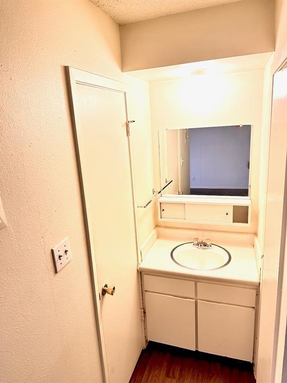 4204 Speedway, Unit 105 Austin, TX 78751 - Photo 7 of 13 a bathroom with a sink and a mirror