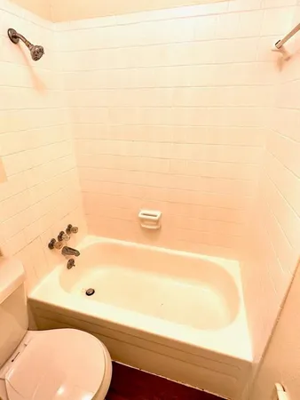 a bathroom with a toilet and a sink