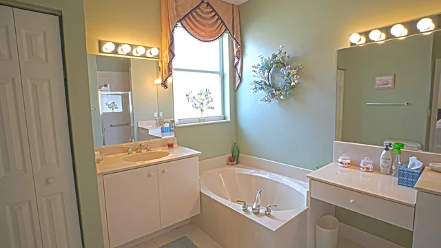 a bathroom with a sink a vanity and a mirror