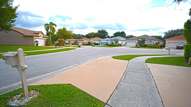 a view of backyard of house and garage