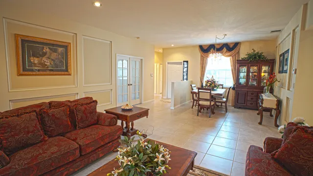 a living room with furniture and a window