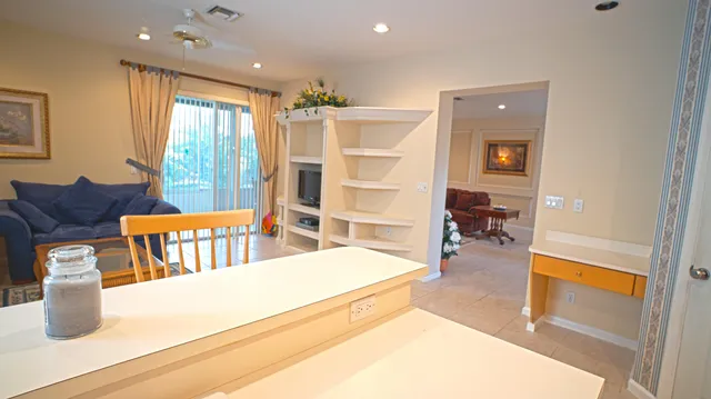 a spacious bedroom with a bed and a view of en suite bathroom