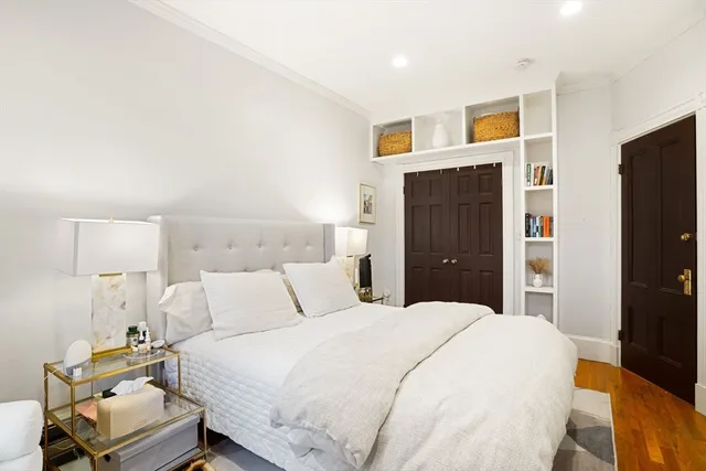 a bedroom with a bed and a tv