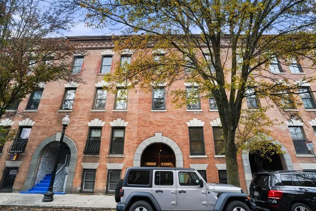 a view of a car park in front of a house