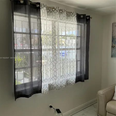 a view of balcony with furniture