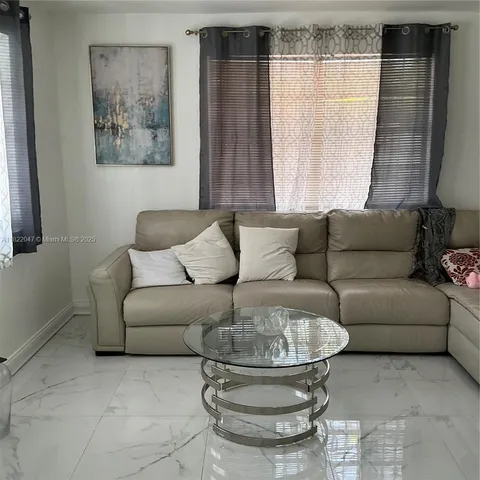 a kitchen with a table and chairs in it