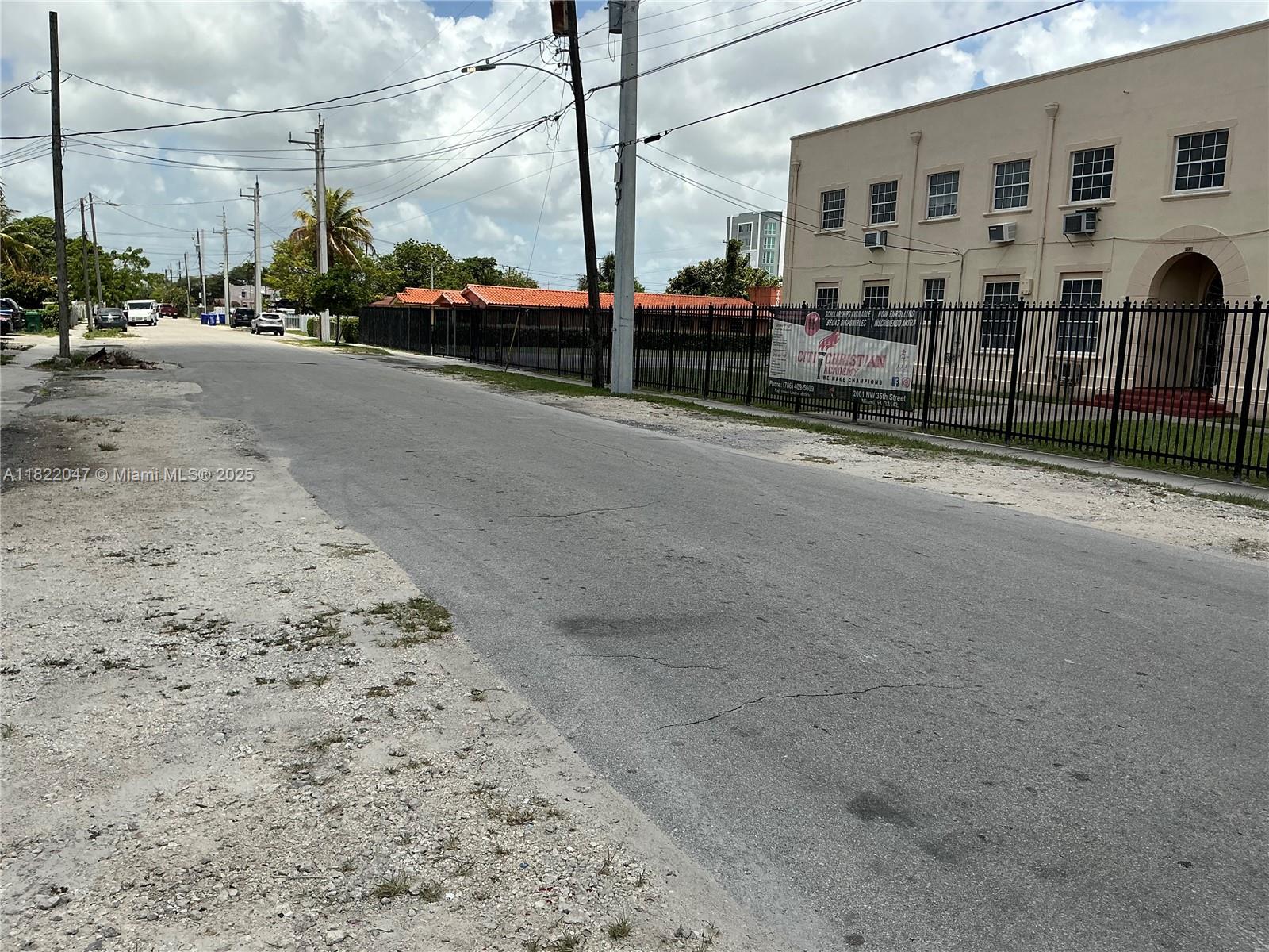 1924 Northwest 35th Street Miami, FL 33142 - Photo 2 of 29 a view of a street with cars