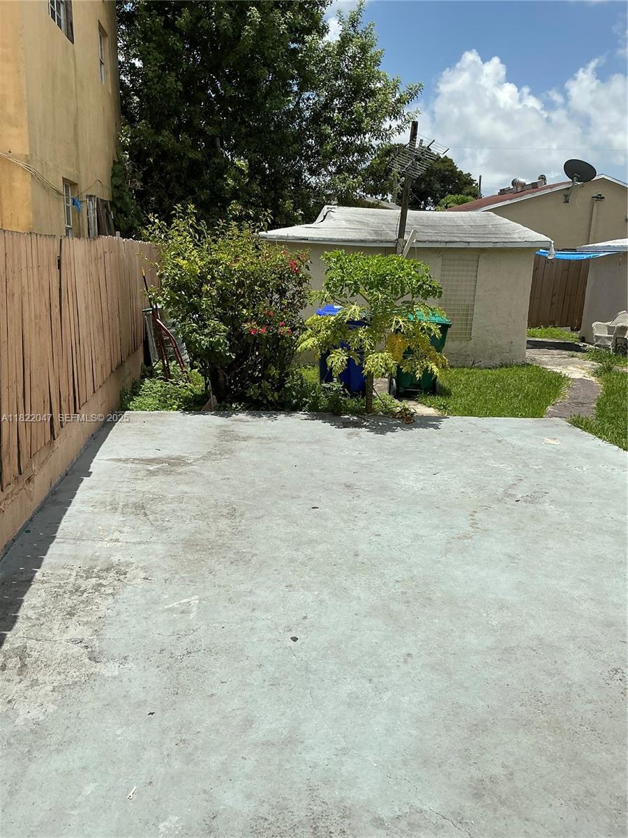 1924 Northwest 35th Street Miami, FL 33142 - Photo 28 of 29 a view of a pathway with a wrought fence