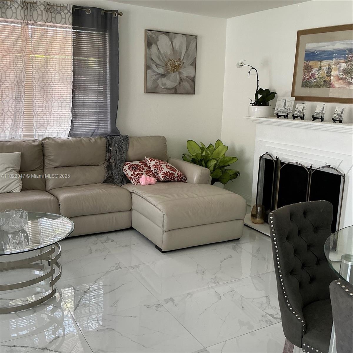 1924 Northwest 35th Street Miami, FL 33142 - Photo 10 of 29 a living room with furniture and a fireplace