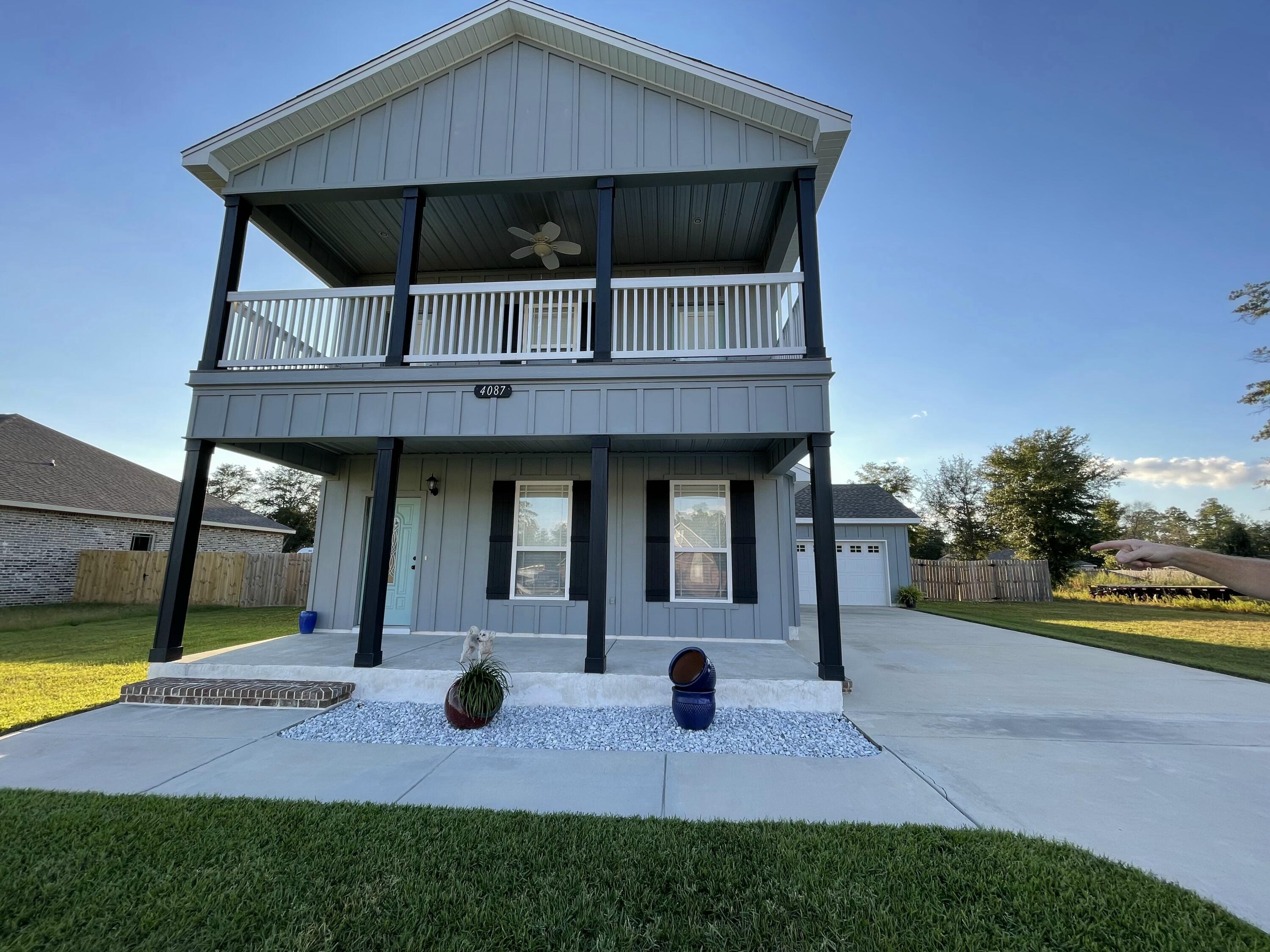 4087 Happy Trails Road Crestview, FL 32539 - Photo 1 of 30 a view of house with backyard outdoor seating and entertaining space