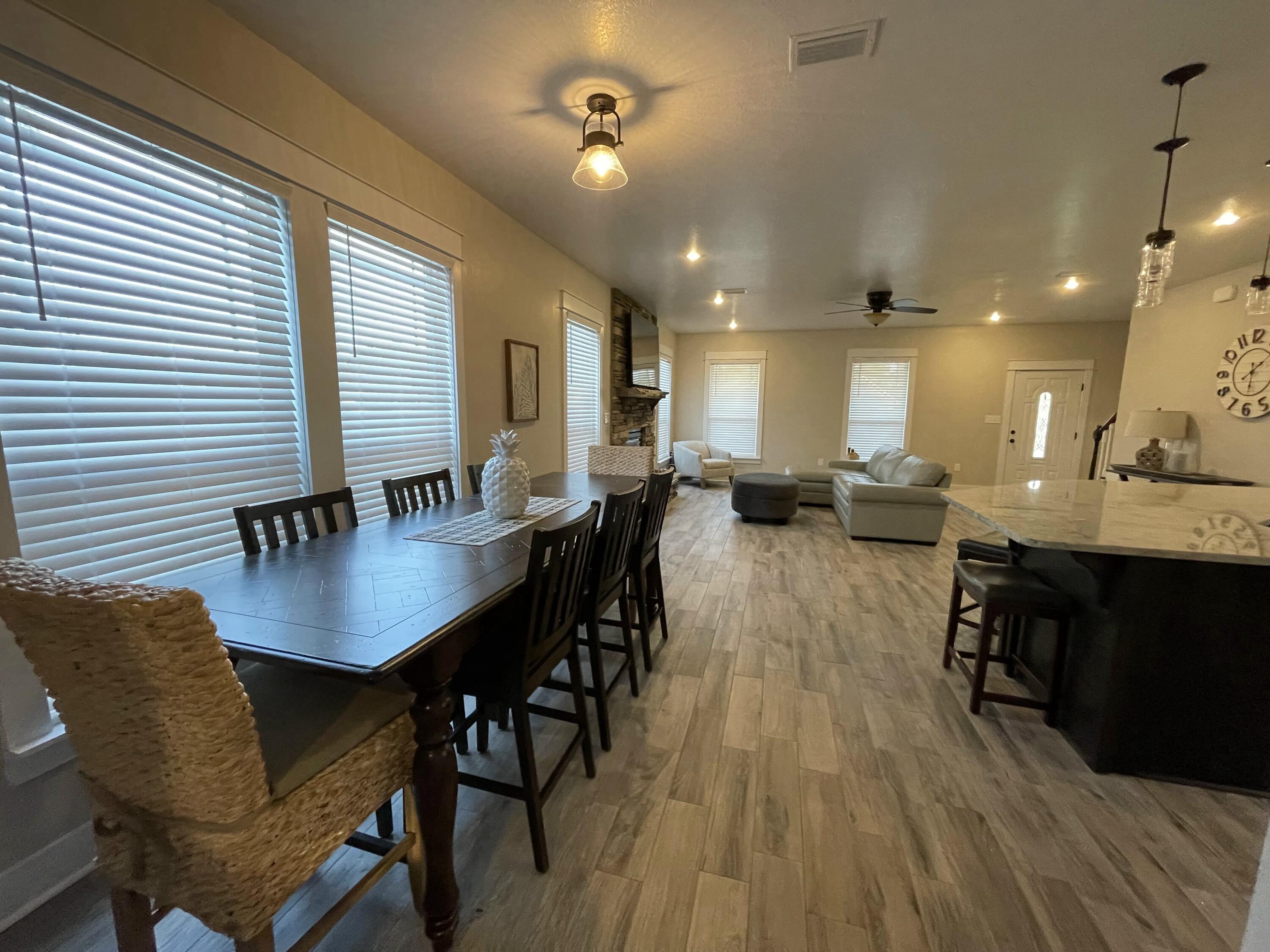 4087 Happy Trails Road Crestview, FL 32539 - Photo 17 of 30 a view of a a dining room with furniture window and wooden floor