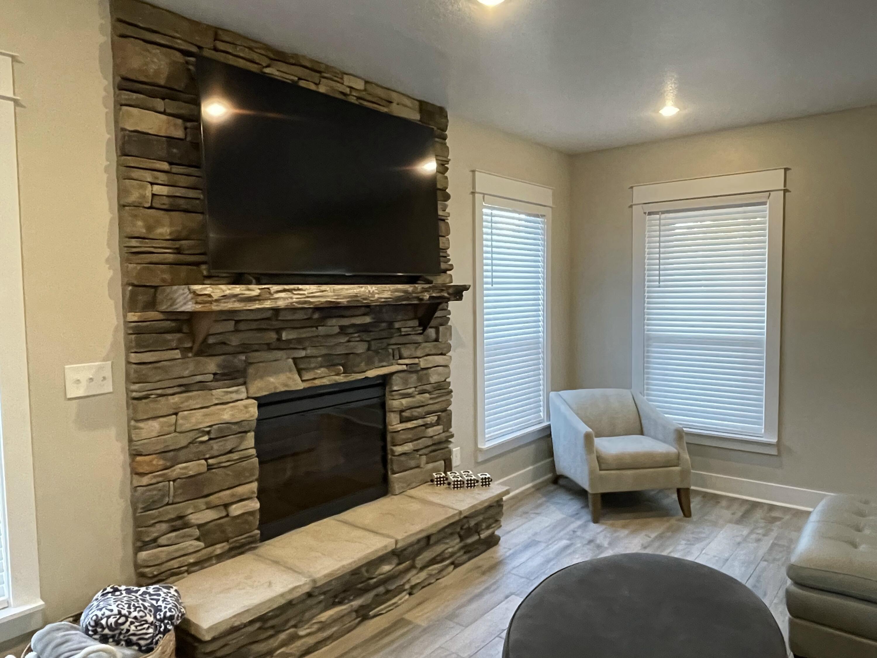 4087 Happy Trails Road Crestview, FL 32539 - Photo 19 of 30 a living room with furniture and a flat screen tv